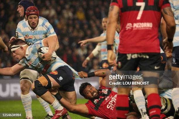 Racing92's Janick Tarrit is tackled during the French Top14 rugby union match between Racing 92 and Rugby Club Toulonnais at the Oceane stadium in Le...