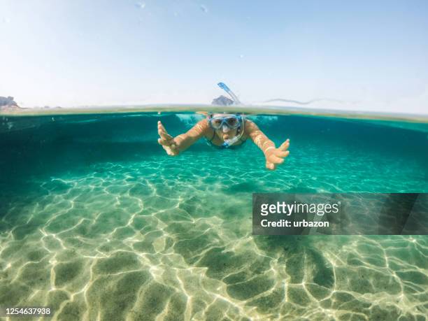 snorkeling and having fun in the sea - aegean sea stock pictures, royalty-free photos & images