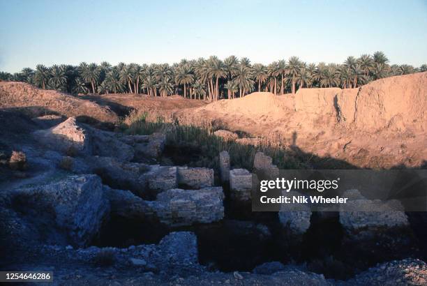 The broken mud brick walls of the archaeological site of Babylon, capital of the ancient kingdom of Babylonia built between the 18th and 6th...