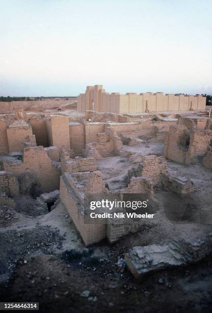 The broken mud brick walls of the archaeological site of Babylon, capital of the ancient kingdom of Babylonia built between the 18th and 6th...