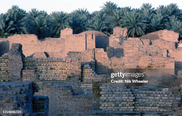 The broken mud brick walls of the archaeological site of Babylon, capital of the ancient kingdom of Babylonia built between the 18th and 6th...