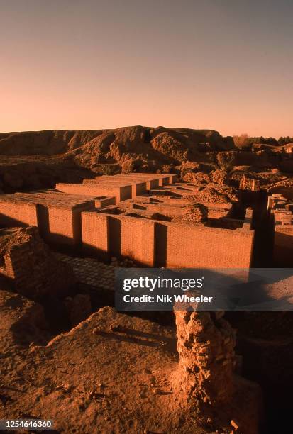 The broken mud brick walls of the archaeological site of Babylon, capital of the ancient kingdom of Babylonia built between the 18th and 6th...