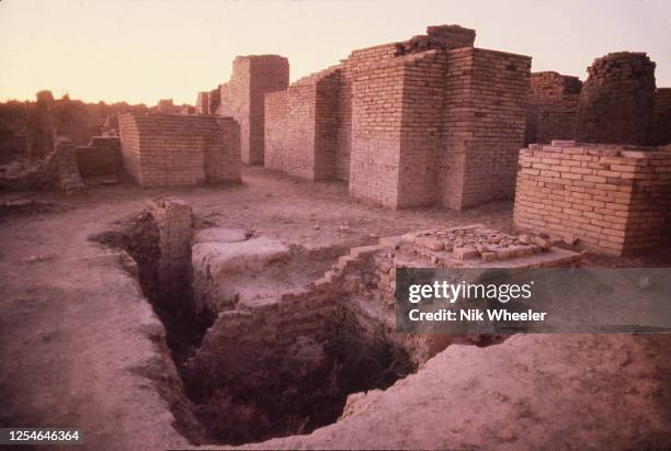 The broken mud brick walls of the archaeological site of Babylon, capital of the ancient kingdom of Babylonia built between the 18th and 6th...