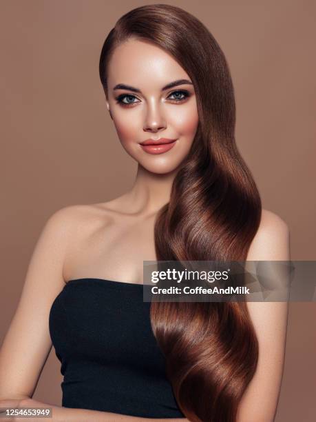 woman portrait with blue eyes and long shiny hair - woman long brown hair stock pictures, royalty-free photos & images