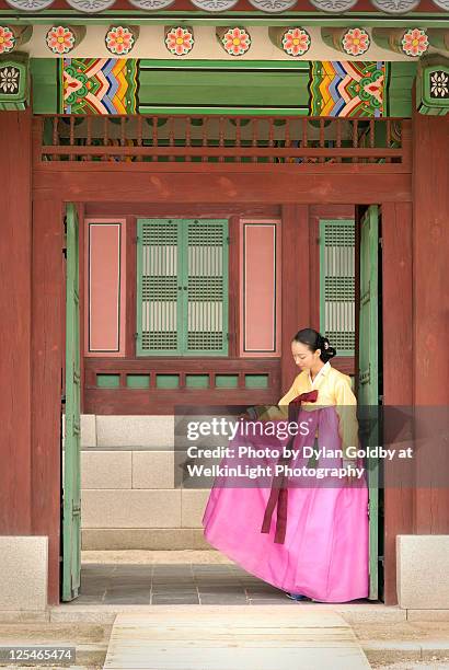 korean woman poses in traditional clothes - korea traditional stock pictures, royalty-free photos & images