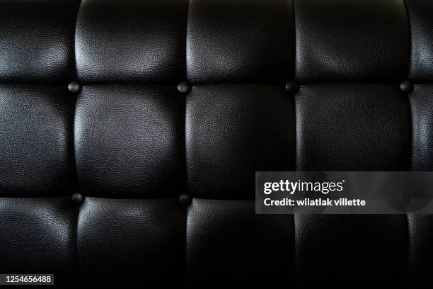 close up black leather and texture background - upholstered furniture stock pictures, royalty-free photos & images