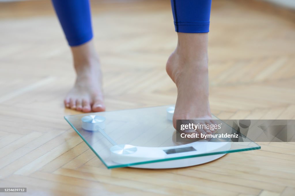 Scale In Feet Female Feet Weighing Scale High-Res Stock Photo - Getty Images