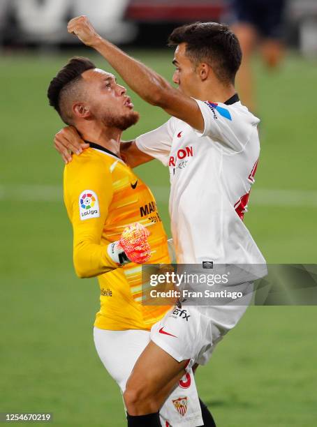 Lucas Ocampos of Sevilla FC celebrates with his team mate Sergio Reguilon of Sevilla FC at the end of the Liga match between Sevilla FC and SD Eibar...