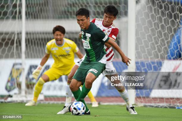 Ryoichi Maeda of FC Gifu controls the ball under pressure of Jung Han Cheol of FC Imabari during the J.League Meiji Yasuda J3 match between FC Gifu...