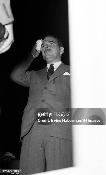 American lawyer, prosecutor, politician and Republican candidate Thomas E. Dewey wipes his brow before thanking the delegates in the Convention Hall...