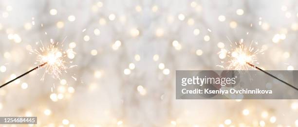 christmas glittering sparklers. decoration lighting element. festive magic sparks lights for holiday poster, birthday or party concept. xmas decoration lighting element. - celebration event fotografías e imágenes de stock