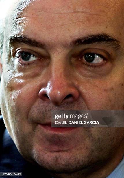 Argentina's new Economy Minister Domingo Cavallo listens to Employment Minister Patricia Bullrrich, during the first cabinet meeting 22 March 2001 in...