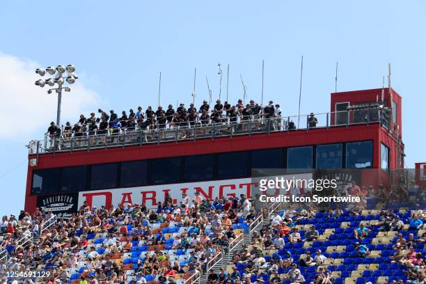 Spotters stand on top of race control building during the running of the NASCAR Xfinity Series Shriners Children's 200 on May 13,2023 at Darlington...