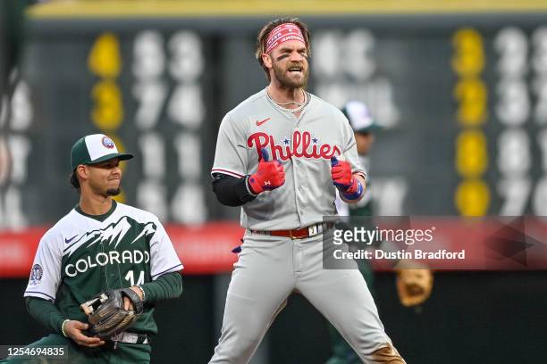 Bryce Harper of the Philadelphia Phillies celebrates after hitting a second inning double in a game against the Colorado Rockies at Coors Field on...