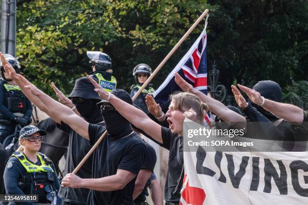 Neo-Nazis protesters with flags salute as they are ordered to leave the area during the demonstration. A day of political tensions and clashes...