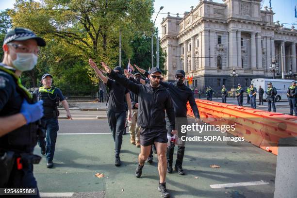 Neo-Nazis protesters salute as they are ordered to leave the area during the demonstration. A day of political tensions and clashes unfolded in...