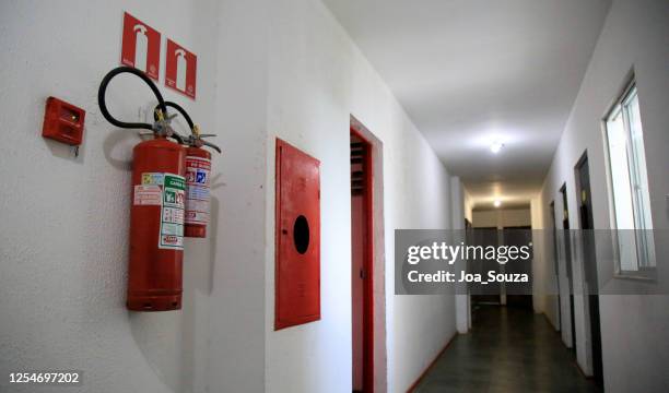 condominium fire extinguisher - fire extinguisher stock pictures, royalty-free photos & images