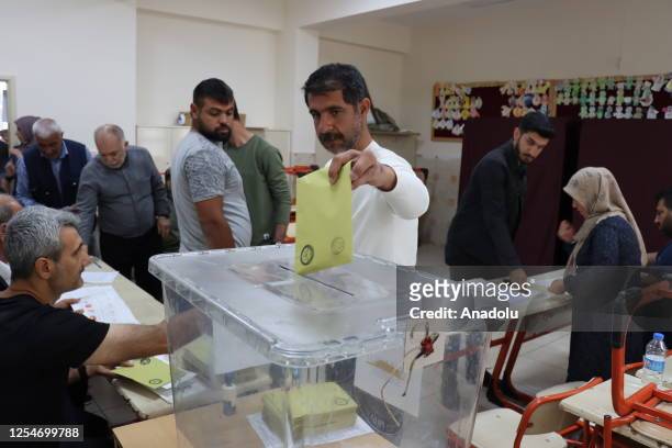 Voters cast their ballots at a polling station for presidential and parliamentary elections in Adiyaman, Turkiye on May 14, 2023. Millions of voters...