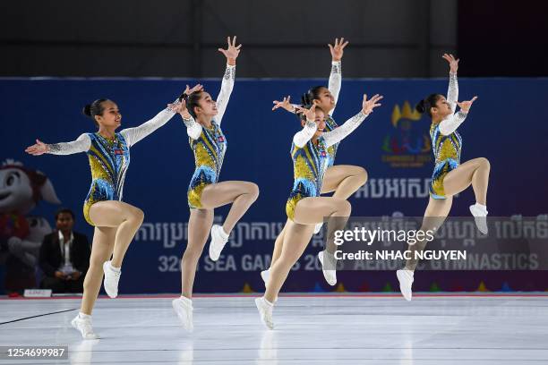 Members of Cambodia's team perform during the artistic gymnastics group final event during the 32nd Southeast Asian Games in Phnom Penh on May 14,...
