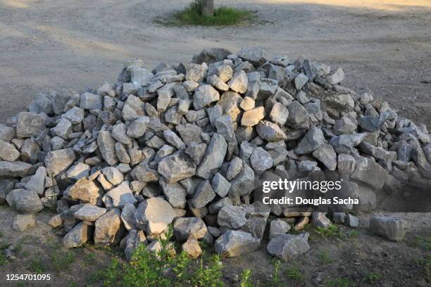 large limestone rock pile on a construction site - pile of rocks stock pictures, royalty-free photos & images