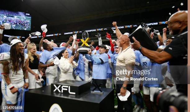 Head coach Bob Stoops of the Arlington Renegades celebrates with the trophy after defeating DC Defenders in XFL Championship game at the Alamodome on...