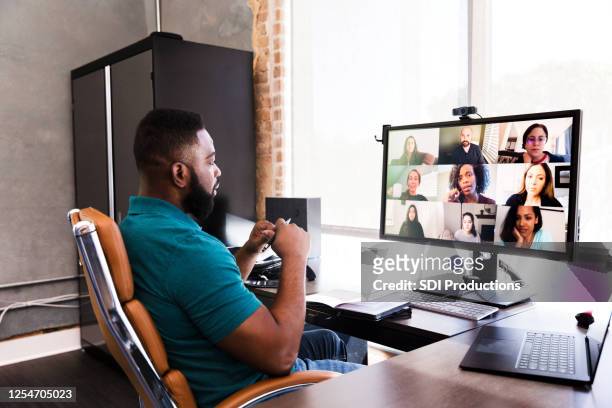 mid adult manager video conferences with his team - telecommuting stock pictures, royalty-free photos & images