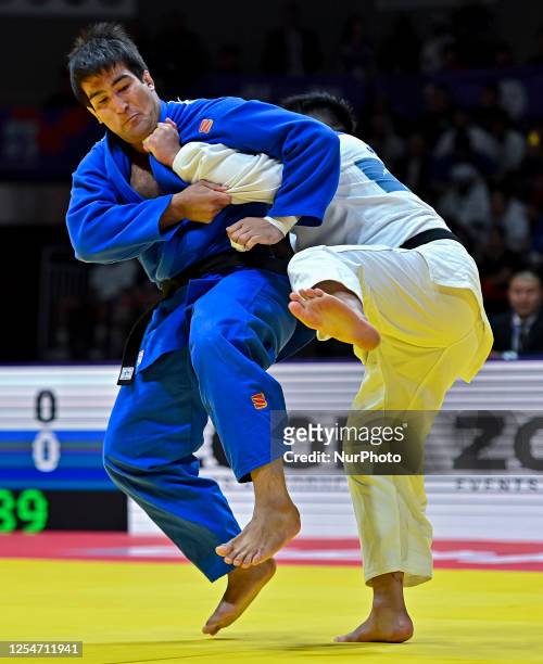 Alisher Yusupov of Uzbekistan and Kokoro Kageura of Japan compete during the men's +100kg bronze medal match of the World Judo Championships 2023 in...