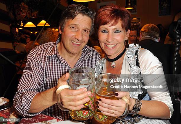 Claudia Jung and her husband Hans Singer attend the Oktoberfest beer festival at Hippodrom beer tent on September 17, 2011 in Munich, Germany.