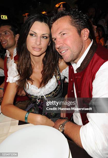 Lothar Matthaeus and Joanna Tuczynska attend attend the Oktoberfest beer festival at Kaefer Schaenke beer tent on September 17, 2011 in Munich,...