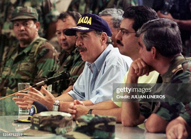 Colombian President Andres Pastrana , military commander General Jorge Mora and Defense Minister Luis Fernando Ramirez field questions from the press...