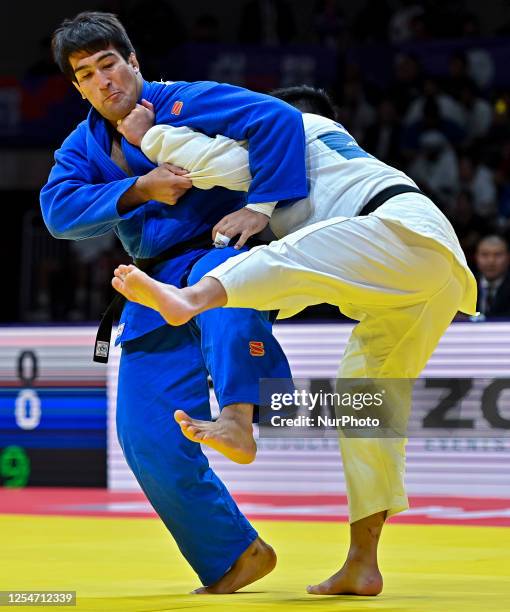 Alisher Yusupov of Uzbekistan and Kokoro Kageura of Japan compete during the men's +100kg bronze medal match of the World Judo Championships 2023 in...