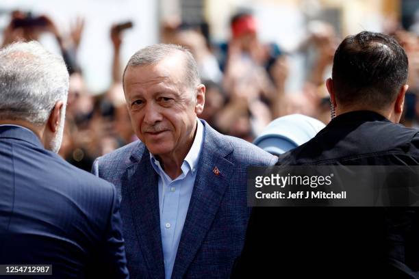 Turkish President Recep Tayyip Erdogan arrives at a school in the Uskudar district to cast his vote in Turkey's General Elections on May 14, 2023 in...