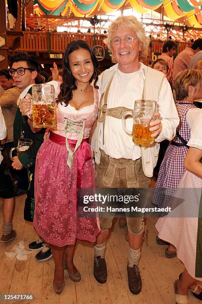 Sinta Weisz and Helmuth von Finck attend the Oktoberfest beer festival at Schuetzenzelt beer tent on September 17, 2011 in Munich, Germany.