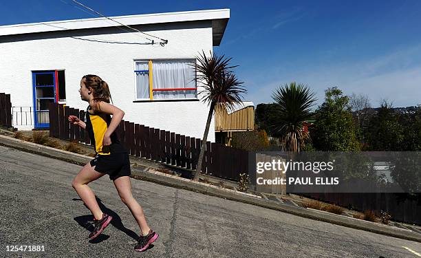 Competitors take part in a race up one of the world's steepest street in Dunedin, New Zealand on September 18, 2011. The race takes place up the...