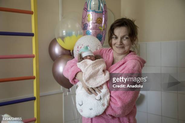 New born baby of 41-year-old Inna is seen with her baby in the maternity section of the 1st City Maternity Hospital in Lviv, Ukraine amid...