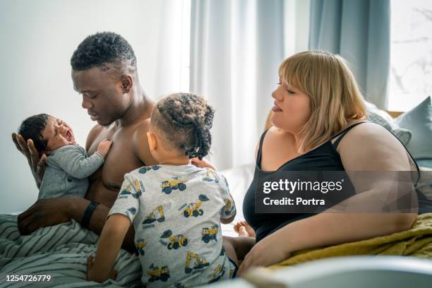 multi-ethnic family spending leisure time at home - moms crying in bed stock pictures, royalty-free photos & images