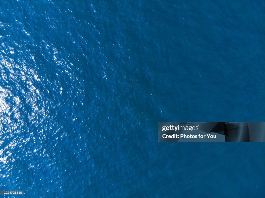 Aerial view/Blue sea and waves and sunlight