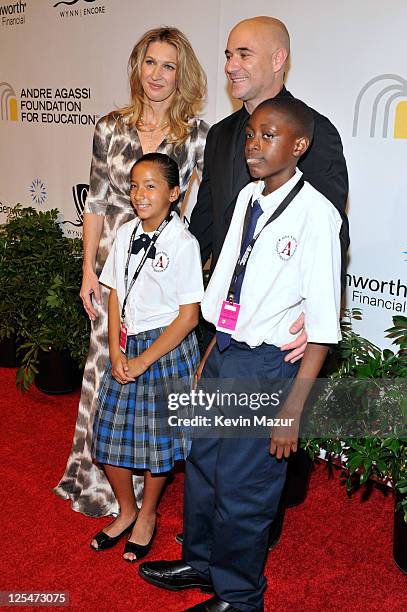 Former tennis players Steffi Graf and Andre Agassi with Andre Agassi College Preparatory Academy students arrive at the Andre Agassi Foundation for...