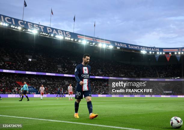 Paris Saint-Germain's Argentinian forward Lionel Messi walks to the touchline during the French L1 football match between Paris Saint-Germain and...