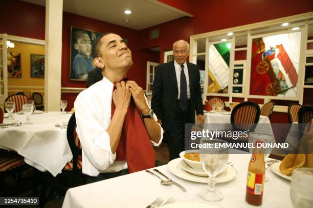 Democratic presidential candidate Illinois Senator Barack Obama puts on a napkin while eating a gumbo with Chairman of Louisiana Recovery Authority...