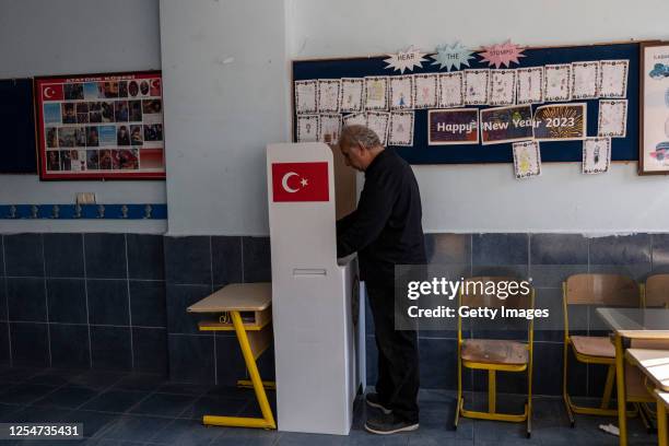 Man casts his vote at a polling station during Turkey's General Election on May 14, 2023 in Antakya, Turkey. Today, President Recep Tayyip Erdogan...