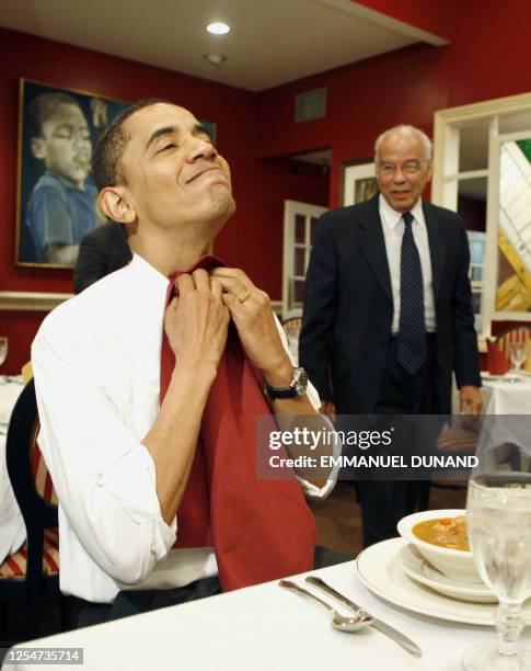 Democratic presidential candidate Illinois Senator Barack Obama puts on a napkin while eating gumbo with the Chairman of Louisiana Recovery Authority...