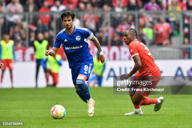 Danny Latza of FC Schalke 04 and Mathys Tel of Bayern Muenchen during the Bundesliga match between FC Bayern Muenchen and FC Schalke 04 at Allianz...