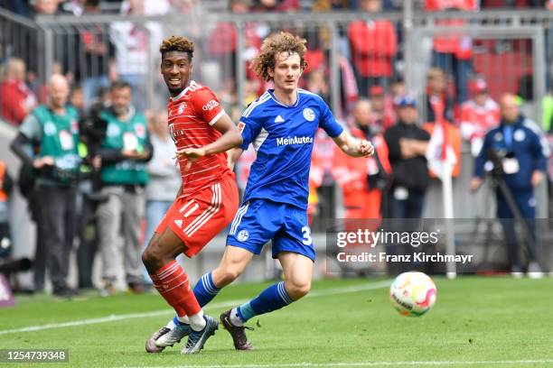 Kingsley Coman of Bayern Muenchen and Leo Greiml of FC Schalke 04 during the Bundesliga match between FC Bayern Muenchen and FC Schalke 04 at Allianz...