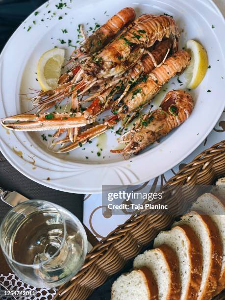 mediterranean culinary scampi shrimps prawns grilled - croazia stock pictures, royalty-free photos & images