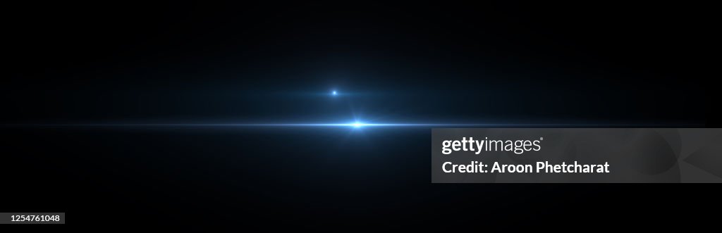 Lens flare light on black background.