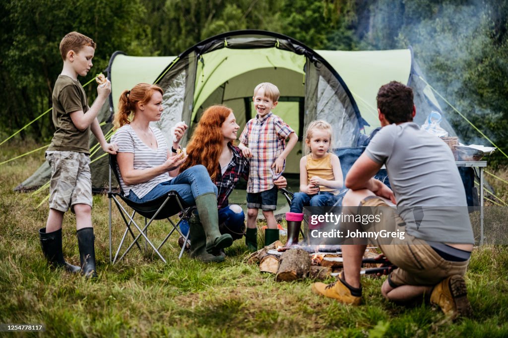 With Dad Playful Young Boy Interacting With Father On Camping Trip High-Res ...