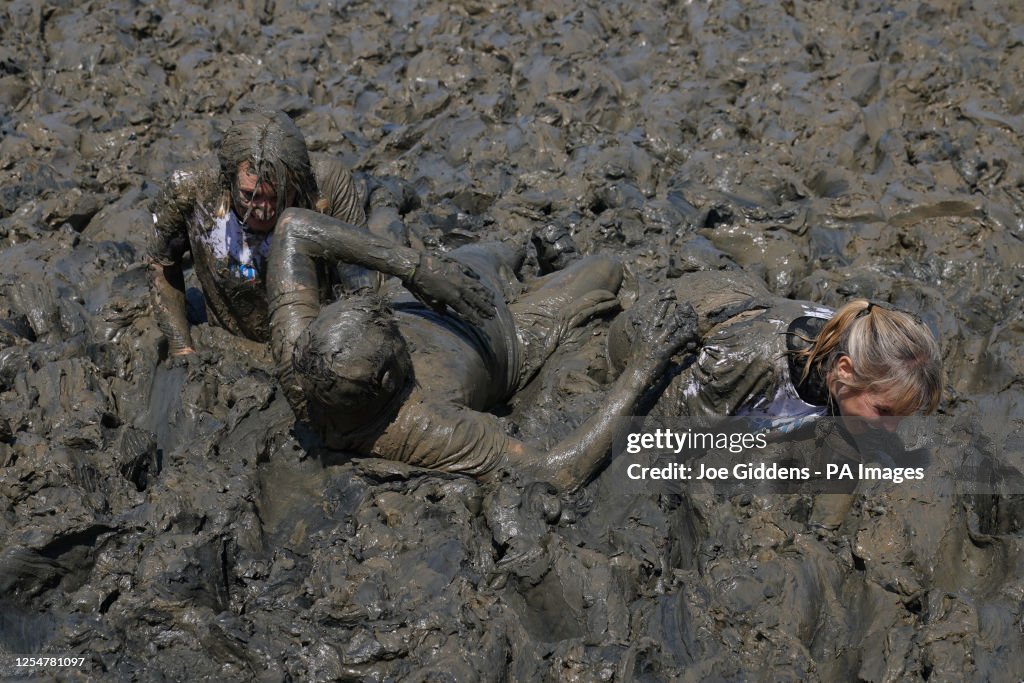Mudf Rice Competitors take part in the annual Maldon Mud Race, a charity event ...