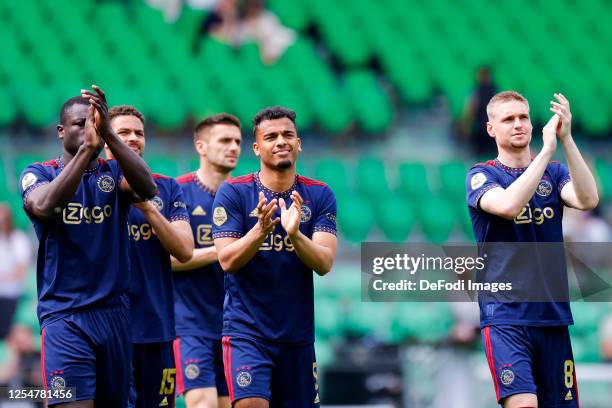 Brian Brobbey, Owen Wijndal, Kenneth Taylor of AFC AJAX thank their supporters after the Dutch Eredivisie match between FC Groningen and AFC Ajax at...