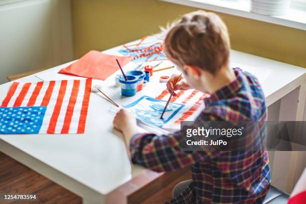 the child draws the flag of america for labour day - fourth of july decorations stock pictures, royalty-free photos & images